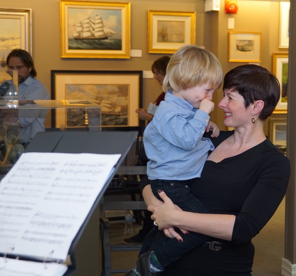 A young fan with his choir mom, Dr. Danielle Kain.